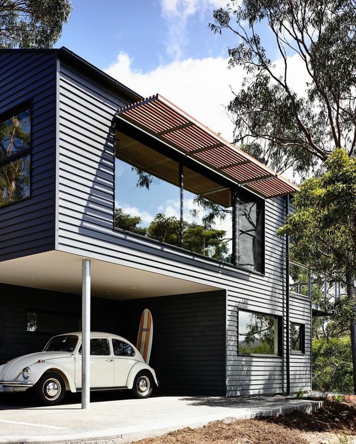 Sweet house, love the underneath garage, and the "outside sun-guards" especially #modern #beetle #bug #vw #dwell #wood #surf #surfboard