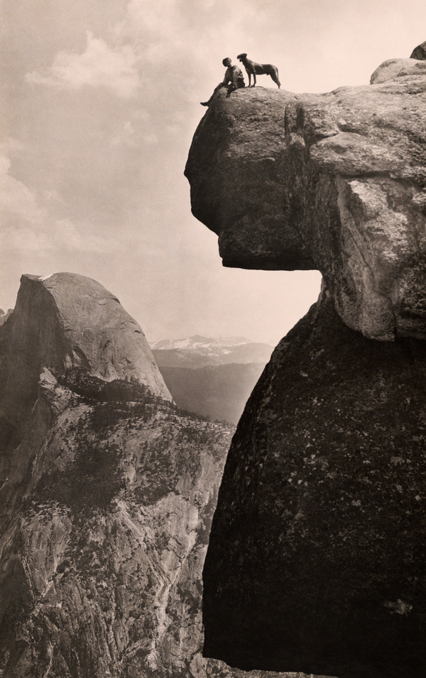 A man and his dog on the Overhanging Rock in Yosemite National Park, May 1924.Photograph by Educational Bruce Photograph #yosemite #geo #rock #landscape #park #nat #overhanging #vintage #film #national