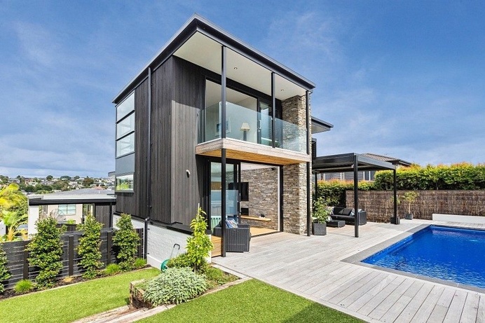 Stylish Contemporary Home with Living Spaces Separated by a Schist Stone Wall 2