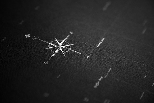 A Typographic Map: constellations of white ink on black paper create a world of typography so mesmerizing you'll have to be careful not to #north #map