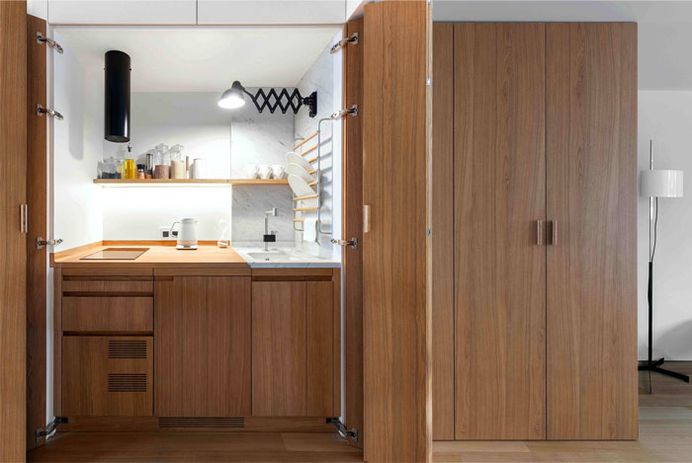 Studio Bazi Create Modern Functional Space from Tiny Apartment - InteriorZine