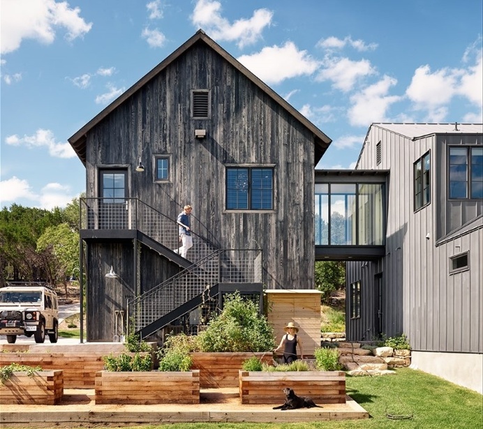 Farmhouse with minimalist glass and metal forms