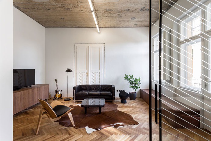 Trendy Terrazzo and Herringbone Parquet at Renovated Apartment by Alexandru Szűz Pop - InteriorZine