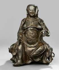 Bronze of seated dressed Zhenwu in a suit of armor