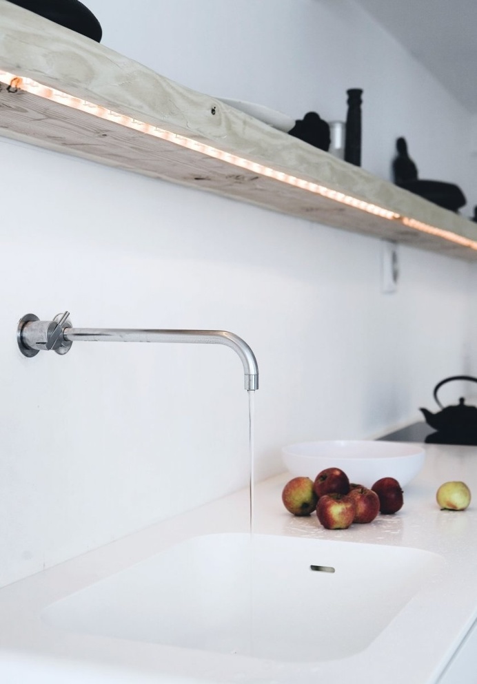 Kitchen countertop with wooden floating shelf. Vedbæk House I by Norm.Architects. © Jonas Bjerre-Poulsen. #kitchen