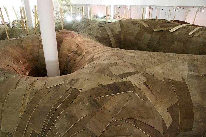 Henrique Oliveira Constructs a Cavernous Network of Repurposed Wood Tunnels at MAC USP #wood #installation