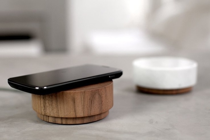 Rest your phone on a wireless charging pad and enjoy great audio while at it. #design #product #modern
