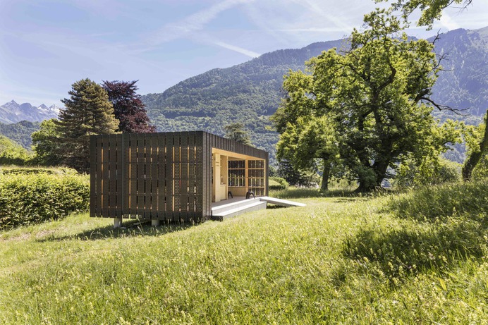 Exterior, Tiny Home Building Type, Concrete Siding Material, and Flat RoofLine Custom-perforated Swisspearl anthracite panels—made of minerals, sand, and cement—allow light to flow into the pavilion.
