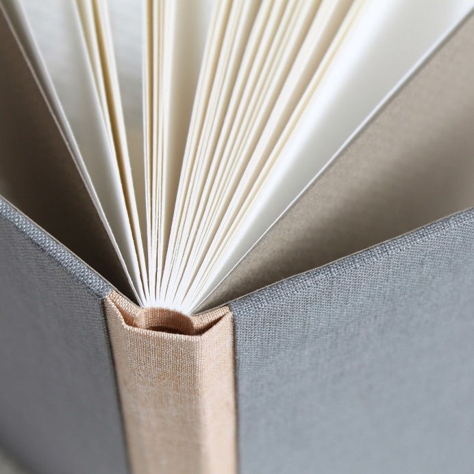 sewn boards binding with linen covers by Kaija Rantakari / paperiaarre.com