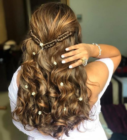 Greek Braids In Wavy Hair Embellished With Flowers