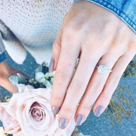 This solitaire engagement ring seems to emanate grace
