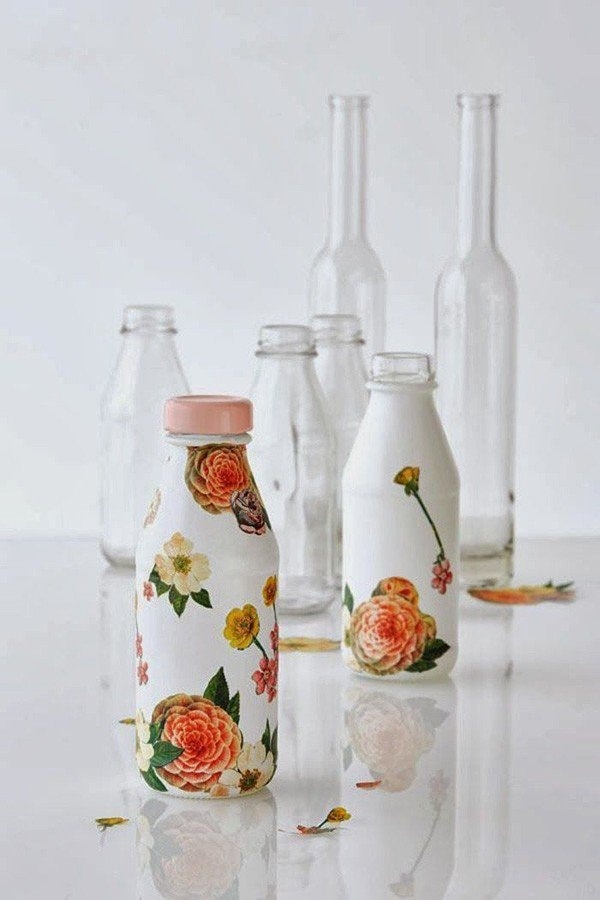 Decoupage! You can paint your wine or any glass bottle in opaque white. When the paint is completely dry, you can select beautiful motifs an