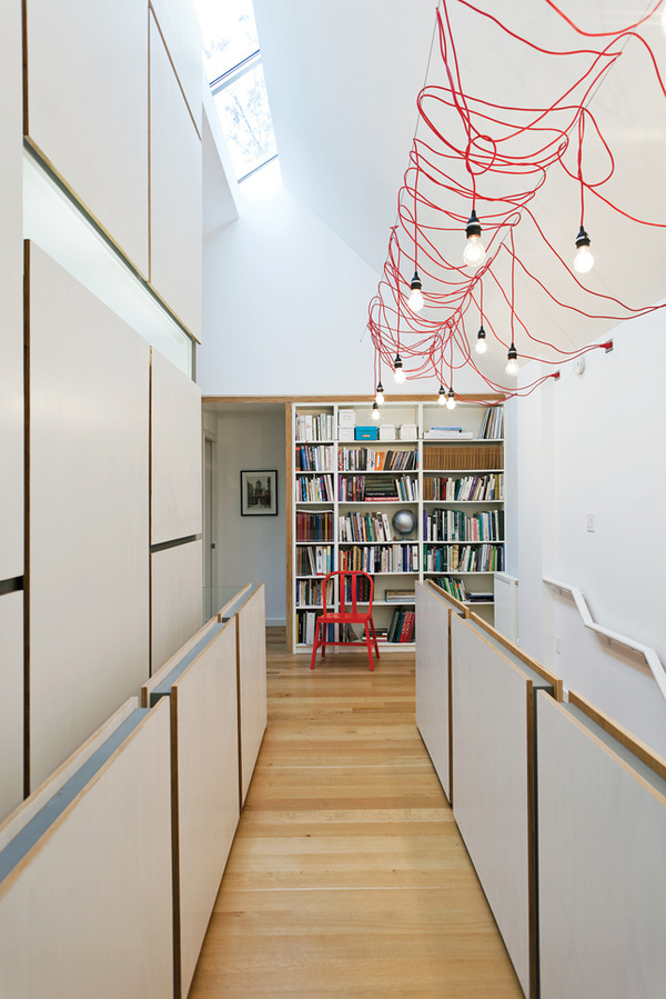 lighting up toronto tudor second story hallway open office library hanging fixtures made from ikea extension cords #interior #design #architecture