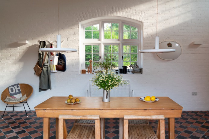Instant summery charm can be had by simply plucking a clutch of wild flowers and putting them in a vase, pitcher, bottle, or whatever vessel you have lying around. Photograph by Jefferson Smith, from The Engine House: A Romantic Rescue in the English Countryside (Available for Getaways). @marttan