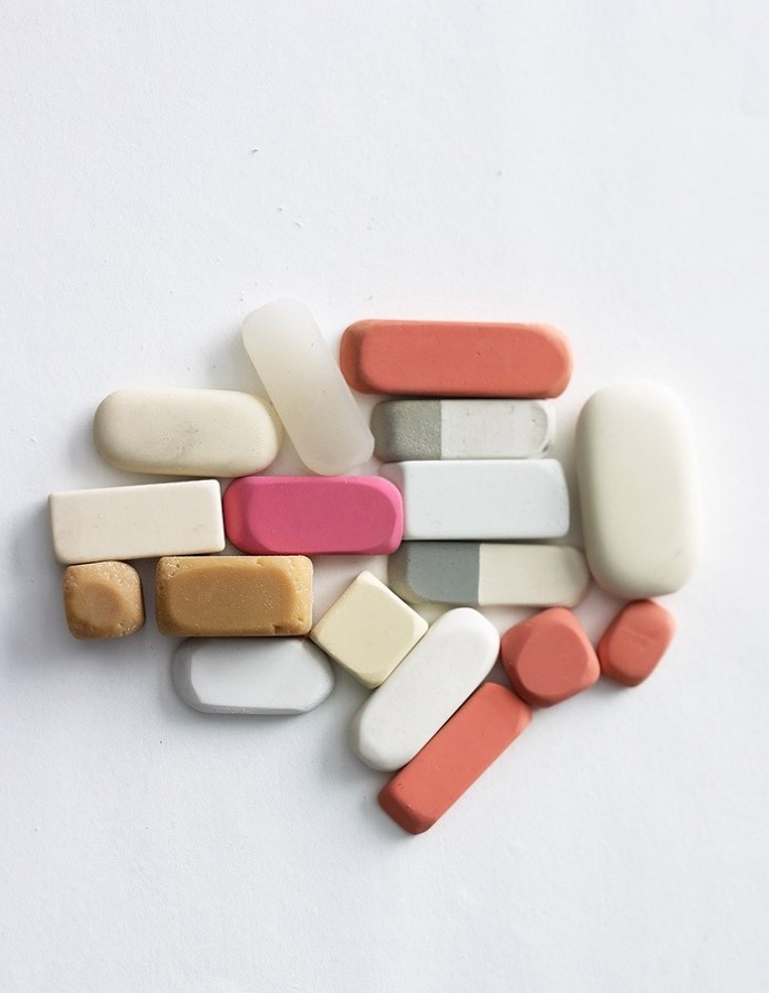 grey pink erasers still life