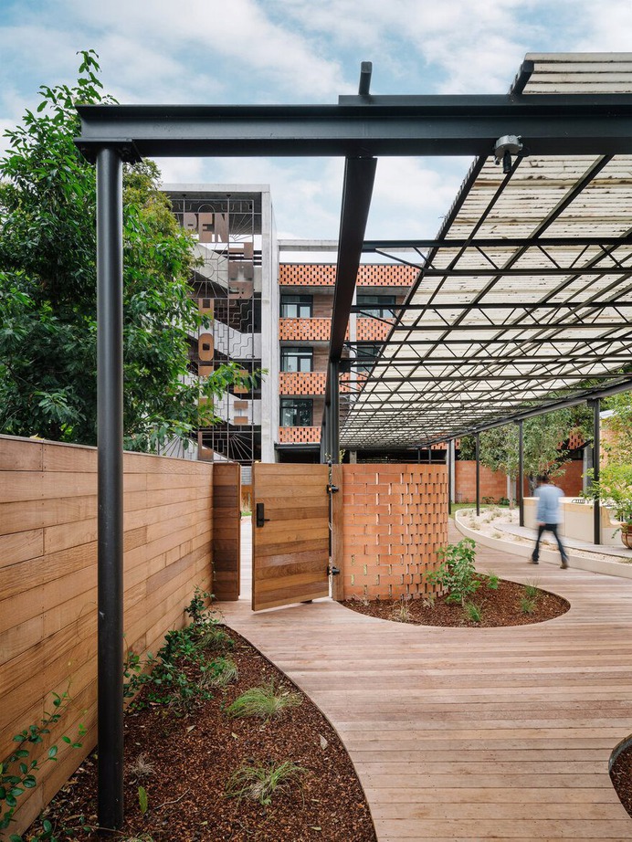 mid-century-utilitarian" carpenters' union hall building convert into hotel near downtown Austin