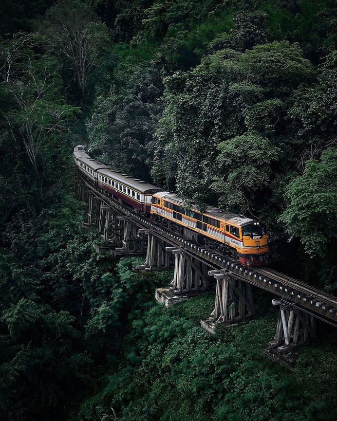Emerging from the forest, a gentle elevated curve in Thailand. Photo by @blowithand #stayandwander by @stayandwander