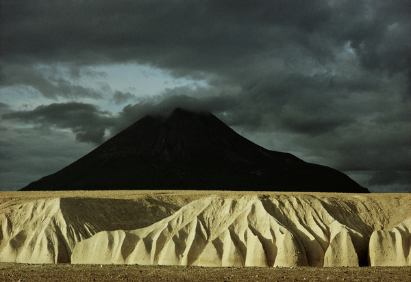 Sheer 100 foot cliffs of eroded ash rise before Mount Katolinat in Alaska.Photograph by Winfield Parks, National Geographic #geo #alaska #landscape #nat #nature #photography #vintage #film #mountains
