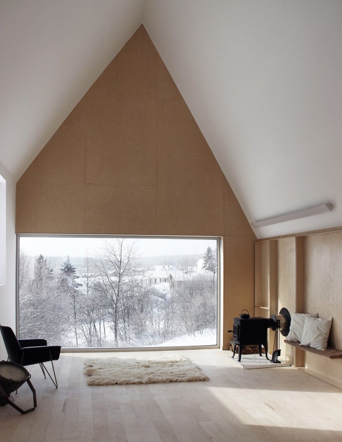 Winter Chalet on Stilts Rises Above a Snow-Laden Slope in Quebec