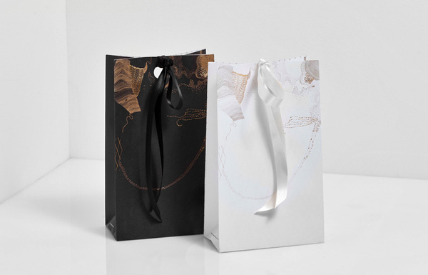 Ribbon tied packaging with gold foil detail designed by Anagrama for San Pedro pastry shop Catalina Fernandez #tied #anagrama #catalina #packaging #designed #shop #san #gold #ribbon #fernandez #pastry #detail #foil #pedro