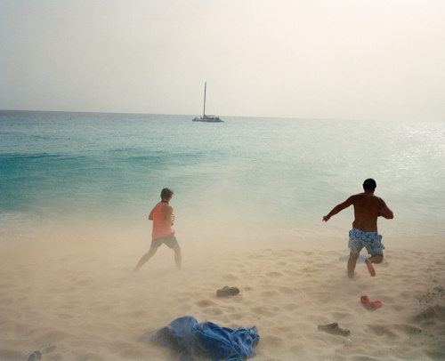 27ca60e30a2d6e1f couplerunning.jpg #wind #water #yellow #people #running #storm #boat #sand #blue #beach #green
