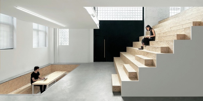 Sunken sitting area and the grand OSB staircase. Jingyuan No.22 Transformation by C+ Architects. #staircase #conferenceroom #workspace