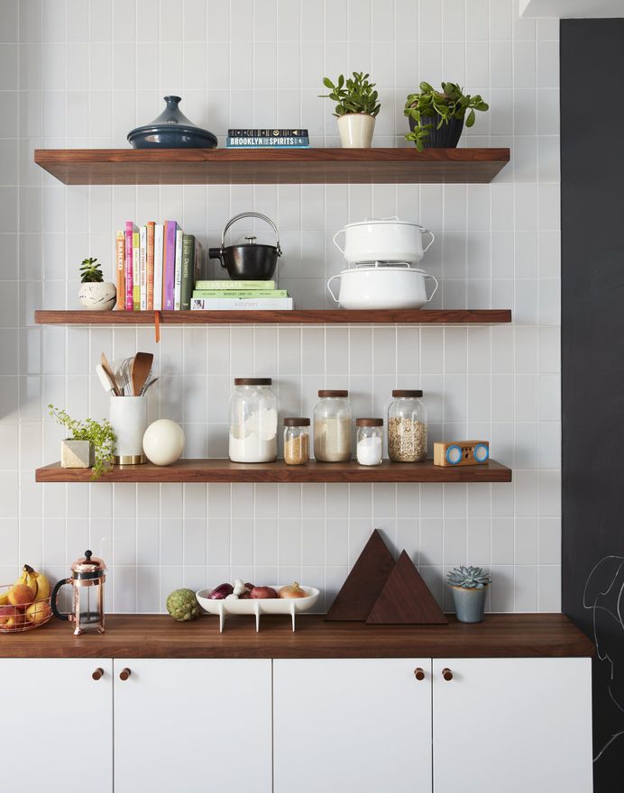 Kitchen, White Cabinet, Wood Counter, and Subway Tile Backsplashe A mix of IKEA and custom walnut shelving; gray subway tile from Nemo Tile; and accessories from Food 52. Photo 8 of 15 in Before & After: A Humdrum Home in Brooklyn Receives a Stylish Revamp