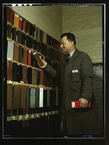 Laboratory worker at the research laboratory at the C & NW RR's 40th Street yard, examining paint samples used on freight cars and coaches of the rail #chicago #railroad #1930s #libraryofcongress #40s #worker