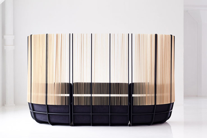 The Hull Sofa features extended back slats with a wrap-around body. This allows users to privately work or converse, without entering an ent