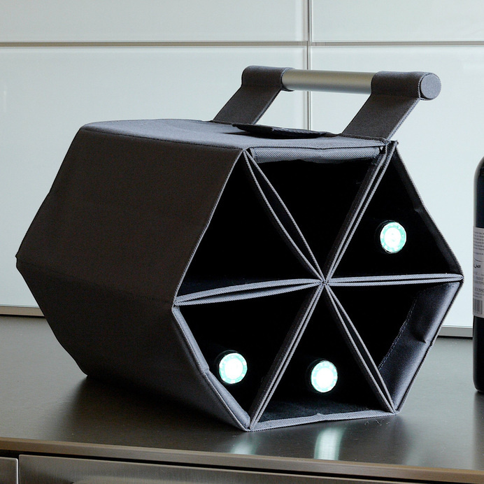 This wine carrier securely transports six bottles, and can be hung as a wine rack. #carrier #modern #design #wine #product #industrial #rack #style