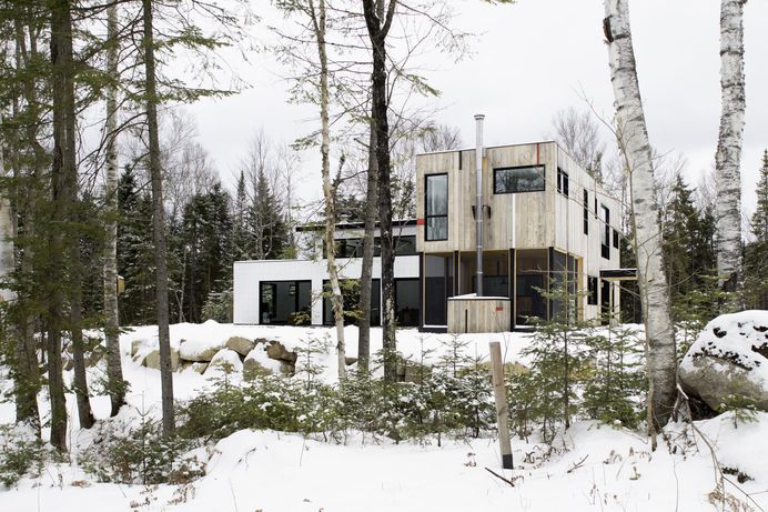 Modern home with Exterior, House, Flat RoofLine, Wood Siding Material, and Metal Siding Material. South façade Photo 2 of Maison Lac Brûlé, #exterior #house #flat #roofline #wood #siding #material #metal