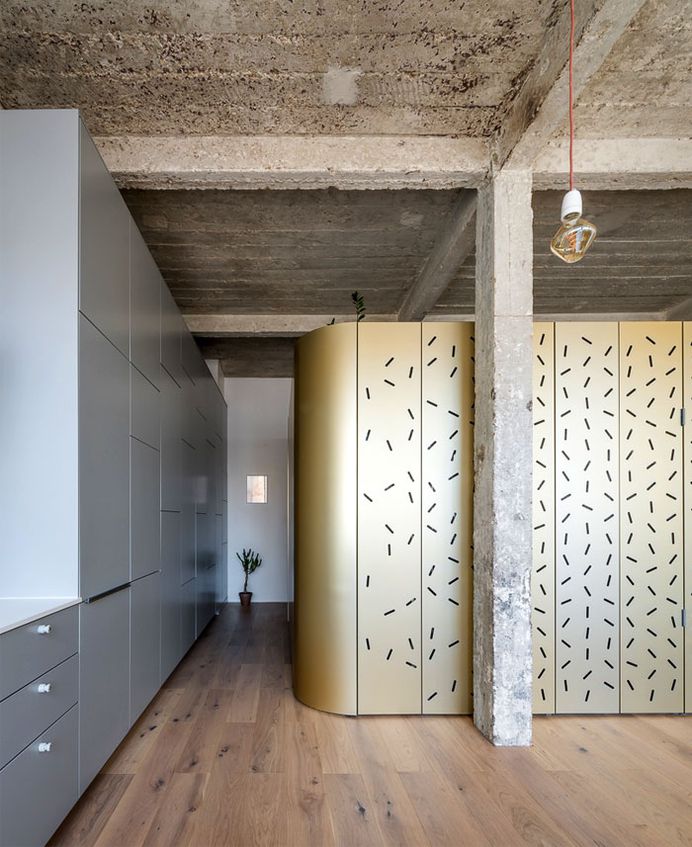 Perforated Aluminum Island at Parisian Apartment by SABO Project - InteriorZine