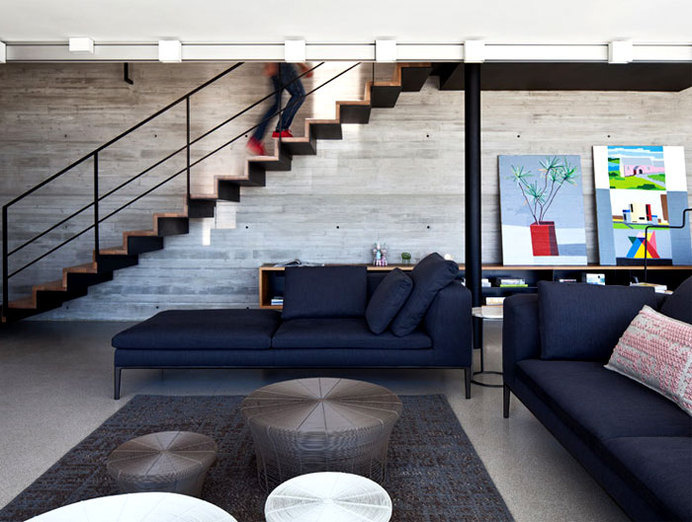 Rooftop Apartment with Exposed Concrete Walls exposed concrete walls living room decor #staircase #interior #concrete #living #stairs #room
