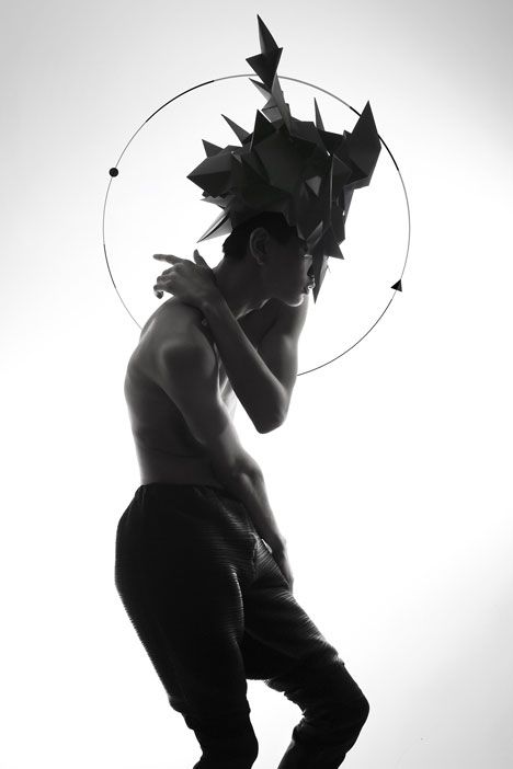 Origami headgear folded to resemble mythological creatures