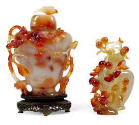 Two floral carved lid vases made of agate