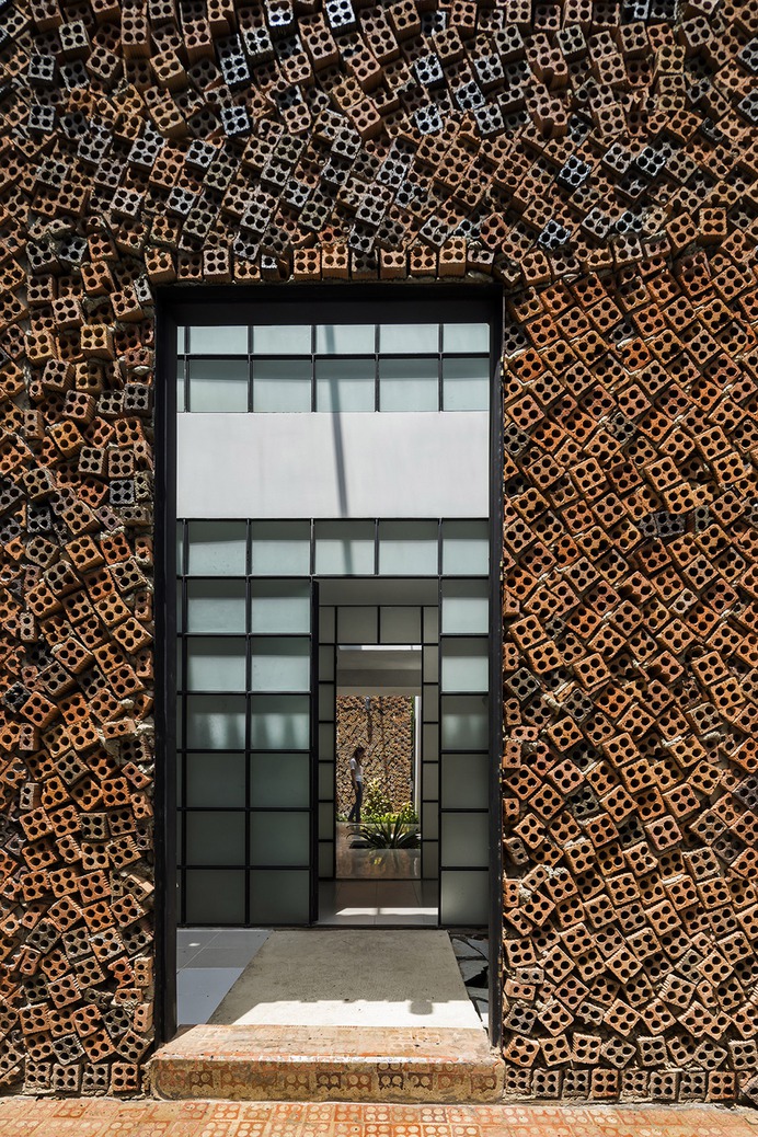 CTA Creative Architects uses perforated bricks to form Wall House