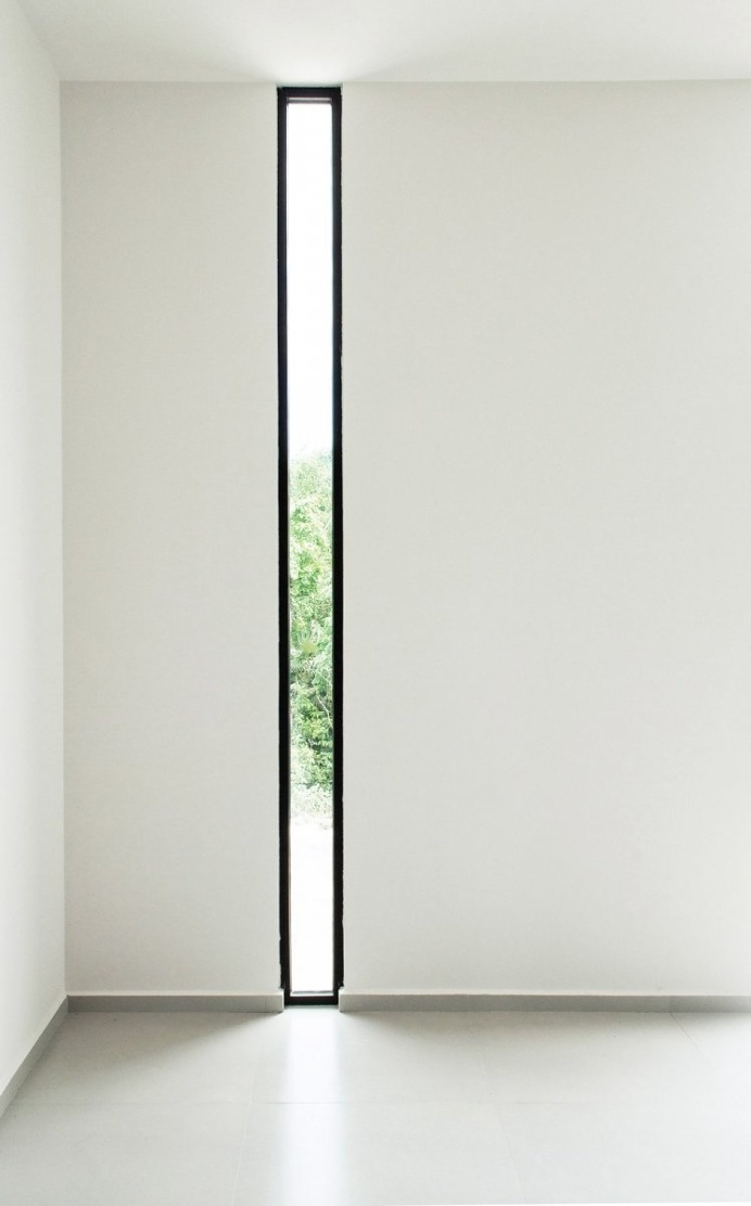 Black framed narrow window. W41 by Warm Architects. © Zaruhy Sangochian. #window #narrowwindow