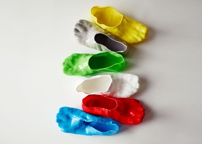 Inspired by cheese fondue, these rubbery slippers are cuztomizable and fit like a second skin! #modern #design #product #industrial #footwear