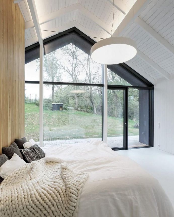 One-Story Family House Covered with Charred Larch Planks 12