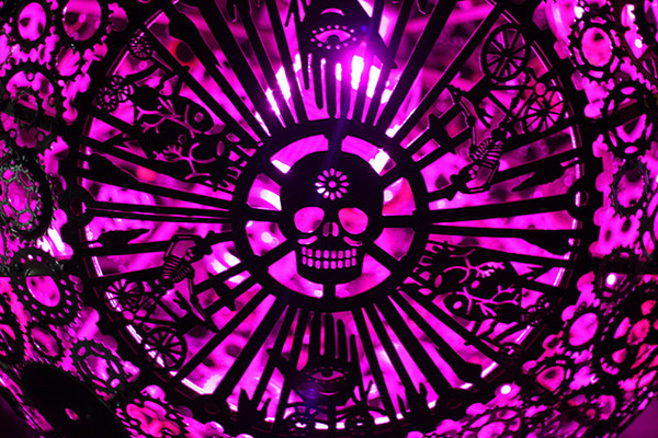 Recycled Bike Part Chandeliers Under a Texas Overpass #color #purple #chandelier #skull #light