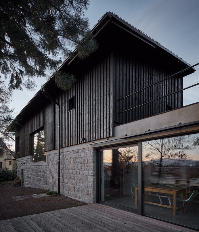 Nordic Esthetics with a Touch of Industrial Style / House Behind The Wall