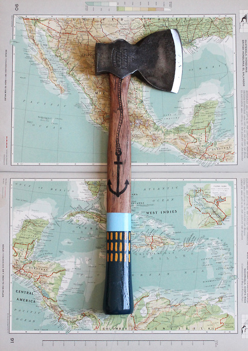A painted axe on an Americas map