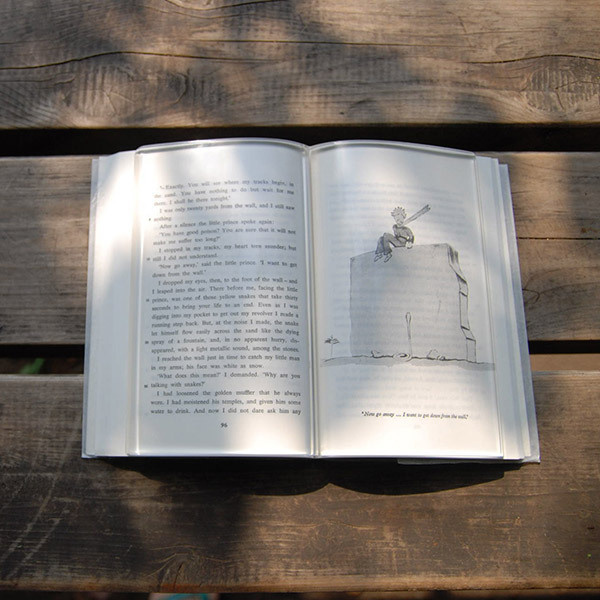 a transparent acrylic book paperweight to hold down the pages of a book from flipping as you enjoy tea while you read #acrylic #reading #book