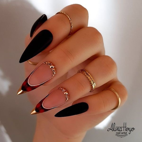 Stiletto manicure with black and red plaid nail tips 