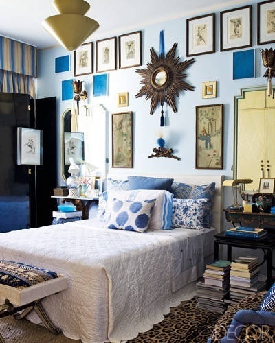 The master bedroom walls are decorated with 18th century chinoiserie paintings and an Italian mirror. #frames #wall #decor #paintings