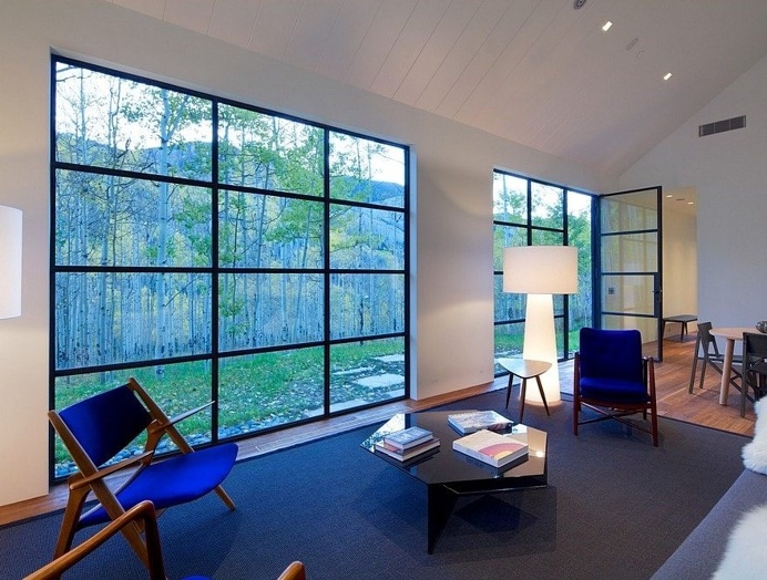 Cottage Black Provides a Retreat Within a Dense Aspen Grove 5