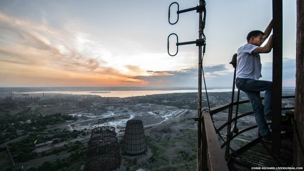 Man climbing a factory chimney stack #photography