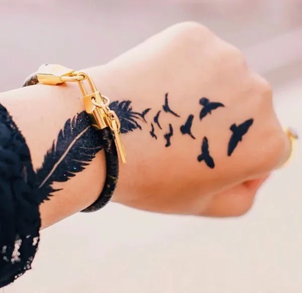 #Birds flying over #feather #tattoo