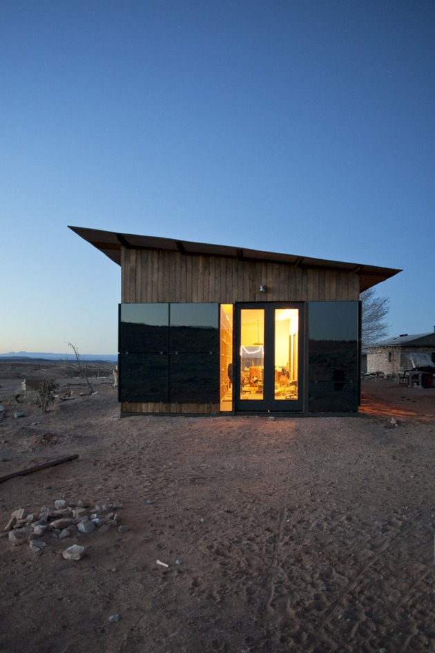 Nakai House in Utah Features Wall of Shelves with Bedroom Niche