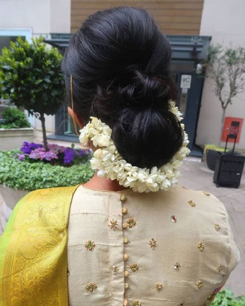 A Big Puff With A Simple Bun Decorated With Gajra